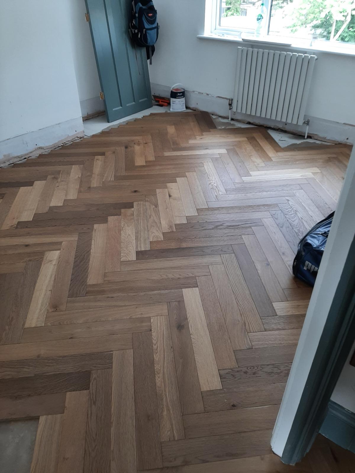 Engineered oak herringbone parquet flooring installation by MN Construction in Essex