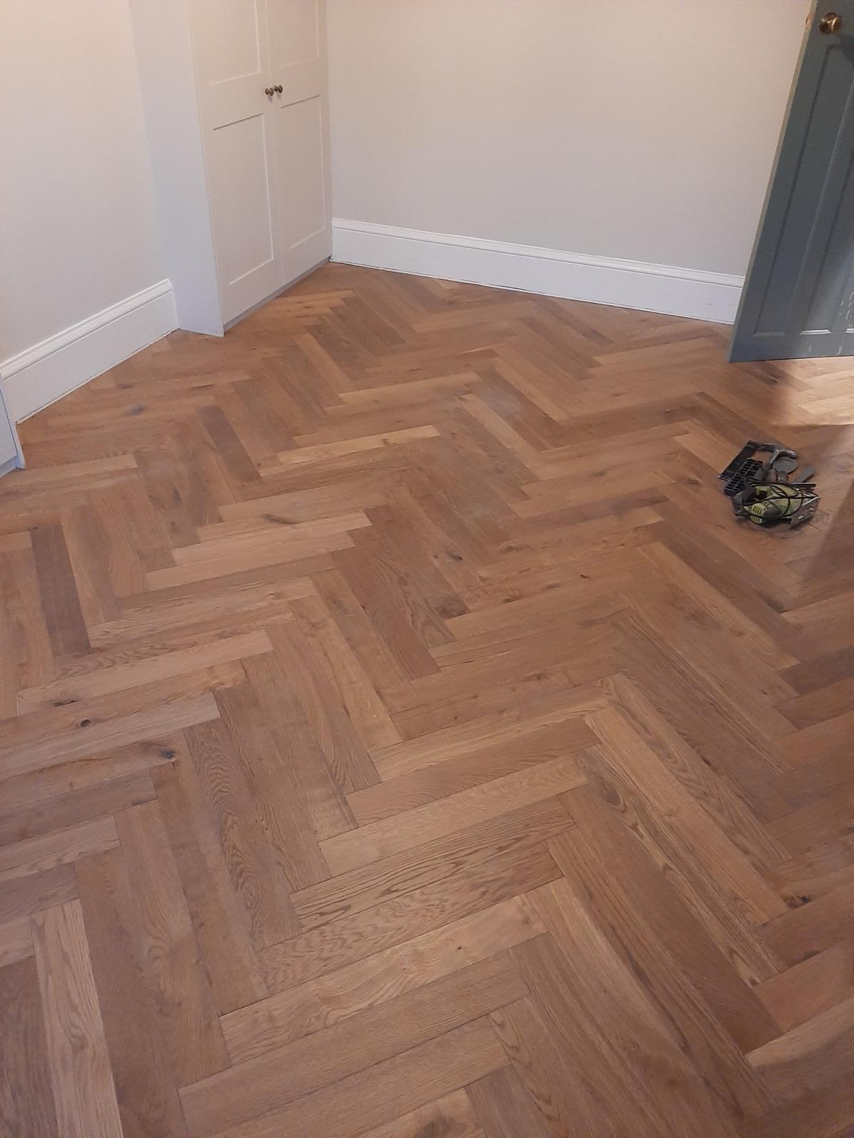 Completed herringbone flooring with matching oak threshold strips