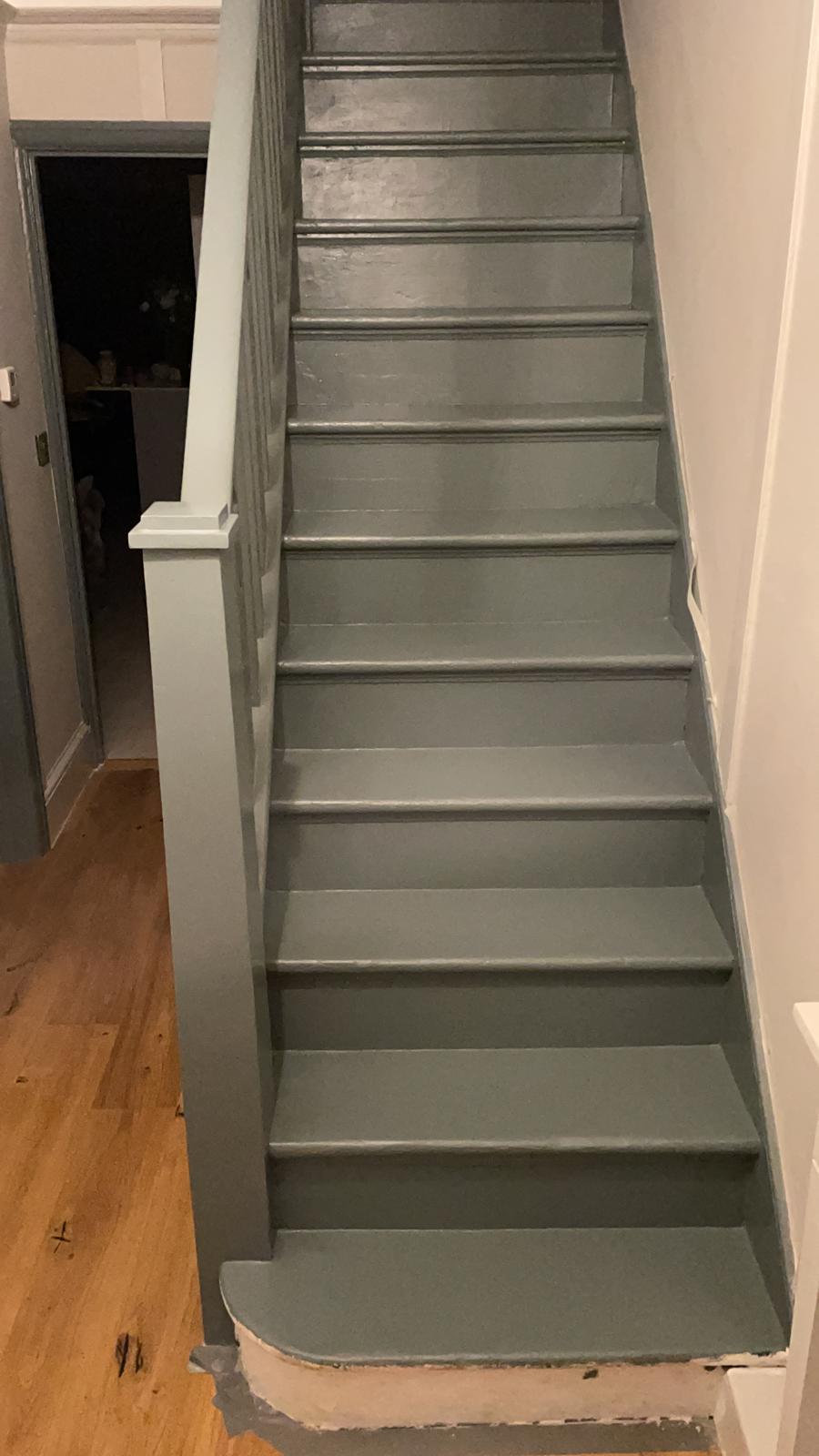 Painted staircase renovation with new handrail and balustrade